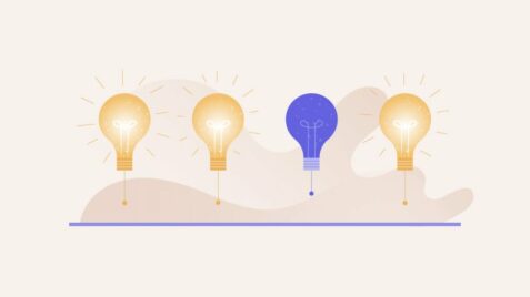 a row of light bulbs with one blue light bulb in the middle