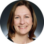 a woman with brown hair smiling in a circle