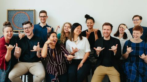 a group of people standing next to each other