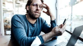 a man with ADHD trying to focus on his work