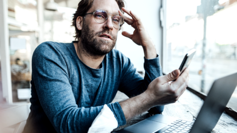 a man with ADHD trying to focus on his work