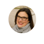 a woman wearing glasses and a scarf