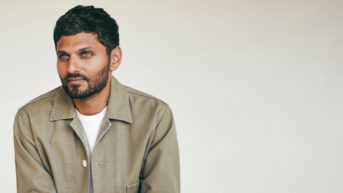 a man with a beard wearing a jacket