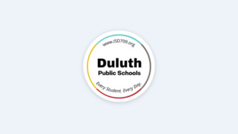 a white button with the words duluth on it