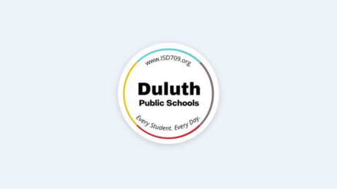 a white button with the words duluth on it
