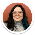 a woman wearing glasses and a turtle neck sweater