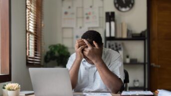 man feeling financial stress