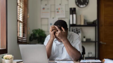 man feeling financial stress