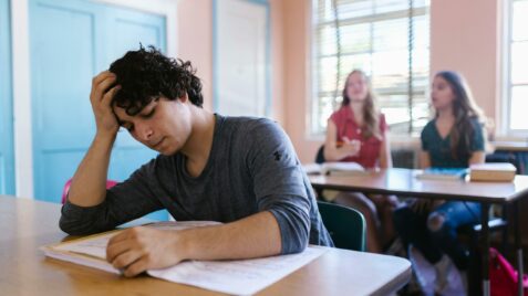 Teen at desk