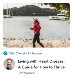 a person running on a beach with a boat in the background