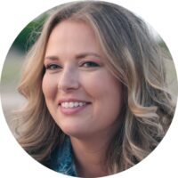 a woman with blonde hair and a blue shirt