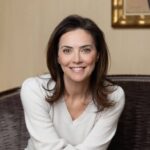 a woman sitting on a couch in a room